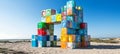 Colorful cube structure on beach art installation under bright blue sky for creative design project Royalty Free Stock Photo