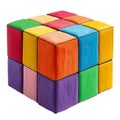 A vibrant, artistic cube crafted from colorful modeling clay on a white surface