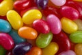 A vibrant assortment of colorful jelly beans showcasing a variety of hues and glossy textures, creating a visually appealing and Royalty Free Stock Photo