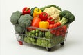 Vibrant assortment of fresh fruits and vegetables in fully stocked supermarket metal shopping cart