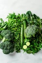 Vibrant Assortment of Fresh Green Vegetables on Light Background