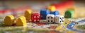 The vibrant assortment of game pieces and dice on a board game. AI generated image Royalty Free Stock Photo