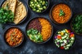 A vibrant assortment of Indian dishes featuring lentils, vegetables, and flatbreads Royalty Free Stock Photo