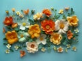 Vibrant Assortment of Paper Craft Flowers in Full Bloom on Soft Blue Background for Springtime Decor Royalty Free Stock Photo