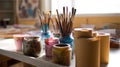 Authentic artist\'s studio with watercolor paints and brushes, illuminated by soft daylight for creativity. Royalty Free Stock Photo
