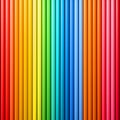 Vibrant background featuring a seamless vertical array of smooth cylindrical tubes arranged in a striking full spectrum rainbow Royalty Free Stock Photo