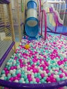 Vibrant Ball Pit Play Zone with Slide and Safety Netting Royalty Free Stock Photo
