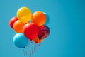 Vibrant balloons against a backdrop of a clear blue sky Royalty Free Stock Photo