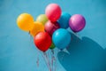 Vibrant balloons against a backdrop of a clear blue sky Royalty Free Stock Photo