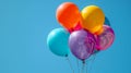 Vibrant balloons against a backdrop of a clear blue sky Royalty Free Stock Photo