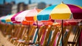 Vibrant beach boardwalk with colorful huts and sun umbrellas, perfect for summer fashion promotion Royalty Free Stock Photo