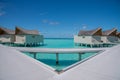 Vibrant beautiful tropical beach landscape of the over water bungalows at luxury resort in Maldives