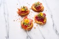 vibrant beetroot hummus bruschettas on a marble surface