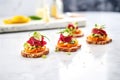 vibrant beetroot hummus bruschettas on a marble surface