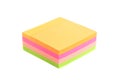 Vibrant block of multicolored post it notes isolated on white.