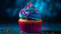 Vibrant blue background sets the stage for a scrumptious birthday cupcake, a delicious treat.