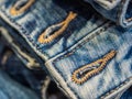 Vibrant blue close up image of waistband of denim jeans with double stitching and metal tack buttons Royalty Free Stock Photo