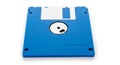 Vibrant blue floppy disk with white label isolated on plain background representing vintage computer data storage technology Royalty Free Stock Photo