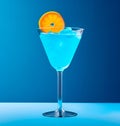 Blue Curacao cocktail garnished with orange slice, in the style of bold color field Royalty Free Stock Photo