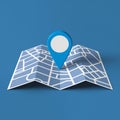 Blue location pin on folded map, simplified city layout, solid blue background, locational theme Royalty Free Stock Photo