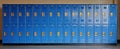 The vibrant blue lockers lined up in a school hallway with bright lighting. AI generated image Royalty Free Stock Photo