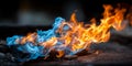 Vibrant Blue and Orange Flames Dancing on Dark Background, Perfect for Copy Space Designs Royalty Free Stock Photo