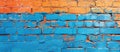 Vibrant Blue, Orange, and Yellow Painted Brick Wall Royalty Free Stock Photo