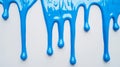 Vibrant Blue Paint Dripping on White Background Isolated with Smooth Finish Royalty Free Stock Photo
