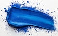 Vibrant blue paint stroke on white canvas Royalty Free Stock Photo