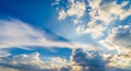Dramatic sky with sunbeams breaking through clouds and wispy cirrus formations light rays Royalty Free Stock Photo