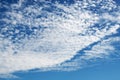 Vibrant blue sky with scattered puffy clouds all over Royalty Free Stock Photo