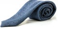A vibrant blue tie elegantly against a white background. Royalty Free Stock Photo