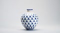 Vibrant Blue And White Ceramic Vase On Clean White Background