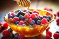 Sweet and Juicy: A Macro Shot of Fresh Berries with Honey Drizzle Royalty Free Stock Photo