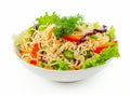 A vibrant bowl of noodle salad with fresh vegetables, isolated on a white background. Royalty Free Stock Photo