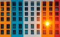 A vibrant building facade with alternating orange and blue panels, showcasing modern architecture Royalty Free Stock Photo