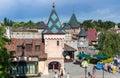 Vibrant, bustling amusement and shopping area on a sunny day with bright blue skies