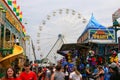 A Vibrant Carnival Atmosphere with Throngs of People Enjoying Rides, Games, and Delicious Treats Royalty Free Stock Photo