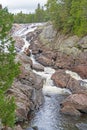 Vibrant Cascade Cutting Through a Rocky Channel