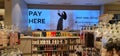 Vibrant cash counter at Marks and Spencer with backlit photo Royalty Free Stock Photo