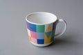 Colorful Geometric Patterned Ceramic Mug on Gray Surface Royalty Free Stock Photo