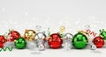 Vibrant Christmas ornaments on a snowy background. Royalty Free Stock Photo