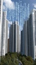 A vibrant city skyline illustrates the integration of technology with binary code overlaying modern buildings under a Royalty Free Stock Photo