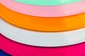 Vibrant close-up of assorted colorful plastic plates Royalty Free Stock Photo