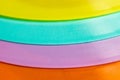Vibrant close-up of assorted colorful plastic plates Royalty Free Stock Photo