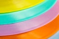 Vibrant close-up of assorted colorful plastic plates Royalty Free Stock Photo