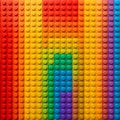 Vibrant close up background texture featuring a meticulous grid arrangement of colorful interlocking plastic building blocks Royalty Free Stock Photo