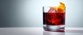 The vibrant cocktail garnished with orange peel and ice cubes. AI generated image Royalty Free Stock Photo