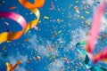 A vibrant collection of streamers floating and swirling through the air, Artsy shot of confetti and colorful ribbons mingling mid-
