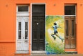 Vibrant color mural of a soccer player on the facade, Buenos Aires, Argentina, South America